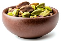 Green cardamom pods and seeds in brown ceramic bowl on white background, aromatic spice ingredient for cooking and flavoring food, isolated.