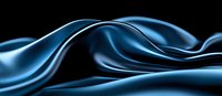 Elegant flowing blue silk fabric waves creating smooth curves and gentle folds against dark background, abstract luxury textile design for fashion and decor.