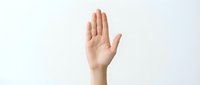 Female hand raised up in stop gesture on white background isolated for design and presentation use.