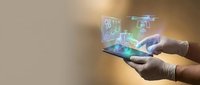 Hands holding smartphone with holographic digital interface displaying futuristic technology elements and glowing data visualization for modern communication.