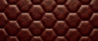 Brown leather hexagonal quilted pattern with detailed stitching and texture for upholstery and interior design projects.