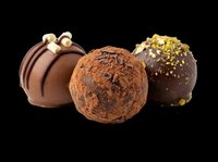 Assorted chocolate truffles and bonbons isolated on transparent background, ready for bakery menus, food packaging, recipe blogs, print-on-demand products, and culinary design projects.
