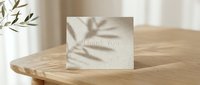 Elegant thank you card on a wooden table with soft leaf shadows and natural light, perfect for weddings, events, and heartfelt greetings.