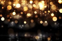 Golden bokeh lights cascade over dark reflective surface creating magical atmosphere for luxury events and celebrations.