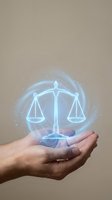 Unrecognizable hand holding glowing neon scales of justice symbol with blue light effects and particles, representing law, legal services, fairness, and balance for business and corporate concepts.