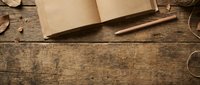 Open notebook with blank pages and wooden pencil on rustic wooden desk surface, suitable for writing, planning, education, and creative projects.