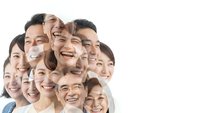 Diverse group of happy smiling people faces clustered together showing joy and positivity on white background for teamwork and community concepts.