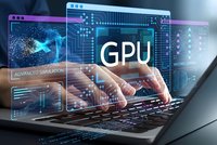 Professional developer working on laptop with GPU processing interface displaying advanced simulation and machine learning analytics overlays.