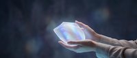 Hands holding glowing holographic crystal orb with iridescent light effect against dark blurred background, suitable for technology, innovation, and futuristic design projects.