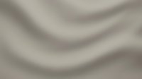 Soft beige fabric with elegant flowing waves and gentle folds creating smooth textile texture for luxury interior design and fashion backgrounds.