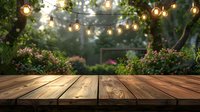 Empty wooden table in garden with string lights and blurred floral background, perfect for product display or summer party decoration. Romantic outdoor setting with bokeh lighting effect.
