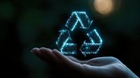 Glowing blue recycling symbol floating above open palm against dark background, representing environmental sustainability and eco-friendly technology concept.