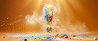 Colorful powder explosion bursting upward with vibrant pigments scattered on surface against warm orange background for creative design projects.