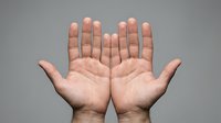 Open hands gesture showing palms facing forward in welcoming pose against neutral background for communication and greeting concepts.
