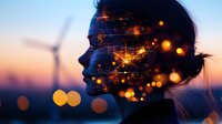 Female silhouette profile against sunset sky with glowing light effects and wind turbine. Double exposure style combining technology network and natural elements.