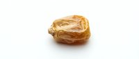 Single dried date fruit isolated on white background for healthy snacking and Middle Eastern cuisine recipes.
