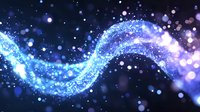 Magical glowing wave of blue and purple particles flowing through dark space with sparkling light effects and bokeh elements. For fantasy backgrounds.