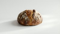 Freshly baked artisan sourdough bread loaf with golden crust and flour dusting isolated on white background for bakery and food design projects.