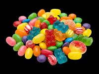 Colorful mixed candy pile with gummy bears, jelly beans, and hard candies isolated on transparent background, ready for t-shirt design, stickers, and print on demand.