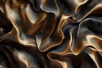 Luxurious brown and black silk fabric with elegant folds and waves creates dramatic light and shadow play, suitable for luxury fashion and interior design backgrounds.