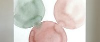 Abstract watercolor circles in soft green and pink tones on white background, perfect for modern design projects and artistic compositions.