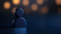 Minimalist silhouette of person symbol against dark background with soft bokeh lights, representing solitude, anonymity, and personal identity in modern society.