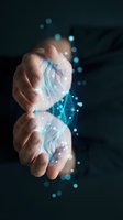 Open palm with digital holographic network and glowing blue particles emerging from hand against dark background, representing technology, innovation, data transfer, and digital transformation for business and tech concepts.