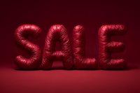 Shiny red metallic balloon letters spelling SALE on deep red background, creating dramatic retail promotion visual for seasonal discounts and special offers.