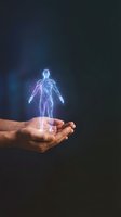 Hands holding glowing holographic human body anatomy figure with blue purple light effects for healthcare technology and medical innovation concepts.