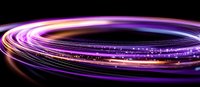 Glowing spiral light trails in purple and gold colors against black background create dynamic motion effect with sparkles and energy flow.