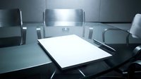 Empty conference room with blank documents on dark table ready for business meeting presentation and corporate planning session.