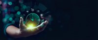 Businessman hand holding glowing clock with digital icons representing time management and productivity concepts for corporate presentations and business solutions.