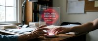 Professional businessman typing on laptop with legal risk indicator notification alert displayed on screen in modern office workspace.