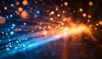 Magical light burst with glowing orange and blue bokeh particles against dark background, creating dynamic motion effect for creative design projects.