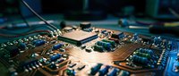 Close-up macro view of computer motherboard with microprocessor chip and electronic components for technology and hardware concepts.