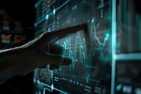 Hand touching digital screen with glowing blue financial charts and market data analytics, dark background with futuristic visualization interface.