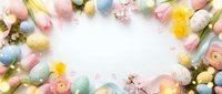 Pastel Easter eggs with spring flowers and decorative elements arranged in circular frame on white background creating festive holiday border for greeting cards.