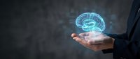 Businessman holding glowing blue brain hologram in open palm representing artificial intelligence, innovation and mental health concepts for technology presentations.