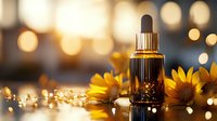 Essential oil dropper bottle with yellow sunflowers against blurred golden bokeh lights background, wellness and aromatherapy concept for spa and natural cosmetics.