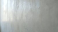 Weathered concrete wall with light gray tones and subtle texture variations, suitable for backgrounds, overlays, and industrial design projects.