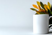 Minimalist composition featuring rubber plant leaves in white ceramic pot against light background, creating modern home decor aesthetic with negative space.