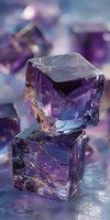 Purple translucent ice cubes with golden inclusions stacked on blurred background, creating magical atmosphere for luxury beverage photography.