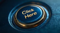 Elegant blue and gold button with "Click Here" text on textured surface, ideal for website call-to-action elements and digital marketing designs.