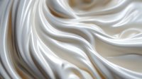 Luxurious white silk fabric with soft flowing waves and elegant folds creates dramatic light and shadow play. Smooth satin texture background for fashion and luxury designs.
