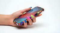 Hand holding colorful gradient smartphone with vibrant neon accents and metallic details, isolated on white background for tech product mockups and digital device presentations.