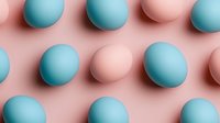 Pastel blue and pink Easter eggs arranged in diagonal rows on pink background creating minimalist geometric pattern. Modern holiday concept.