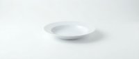 Empty white ceramic plate on clean white background isolated for kitchen dining restaurant menu design presentations.