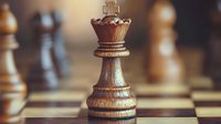 Wooden chess king piece on classic board with soft focus background, highlighting strategy and leadership in competitive gameplay and business concepts.