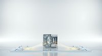 A miniature cityscape model sits centered on an open book, surrounded by glowing blue light points, symbolizing digital connectivity and urban development for technology and business concepts.