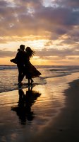 Romantic couple silhouette dancing on beach at sunset with golden sky and ocean waves reflecting on wet sand creating intimate moment for love concepts.